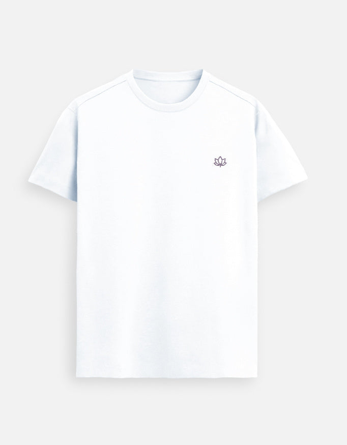 White women’s premium Supima cotton t-shirt with minimalist lotus logo, ultra-soft luxury casual wear styled on a city street
