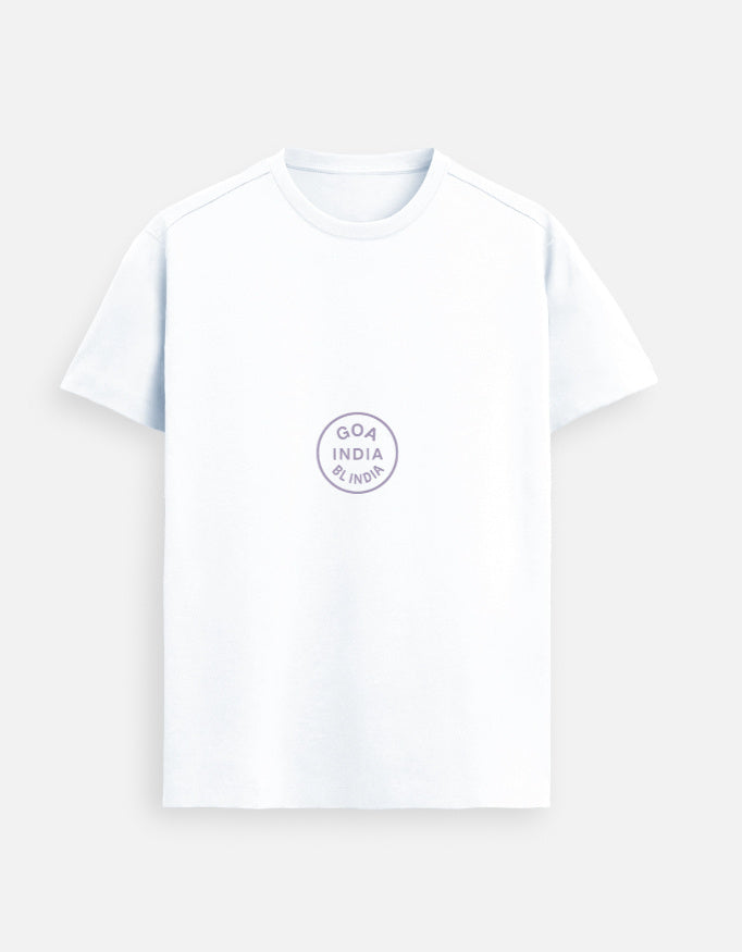 White women’s premium Supima cotton t-shirt with minimalist circular print, luxury streetwear styled in an urban city setting
