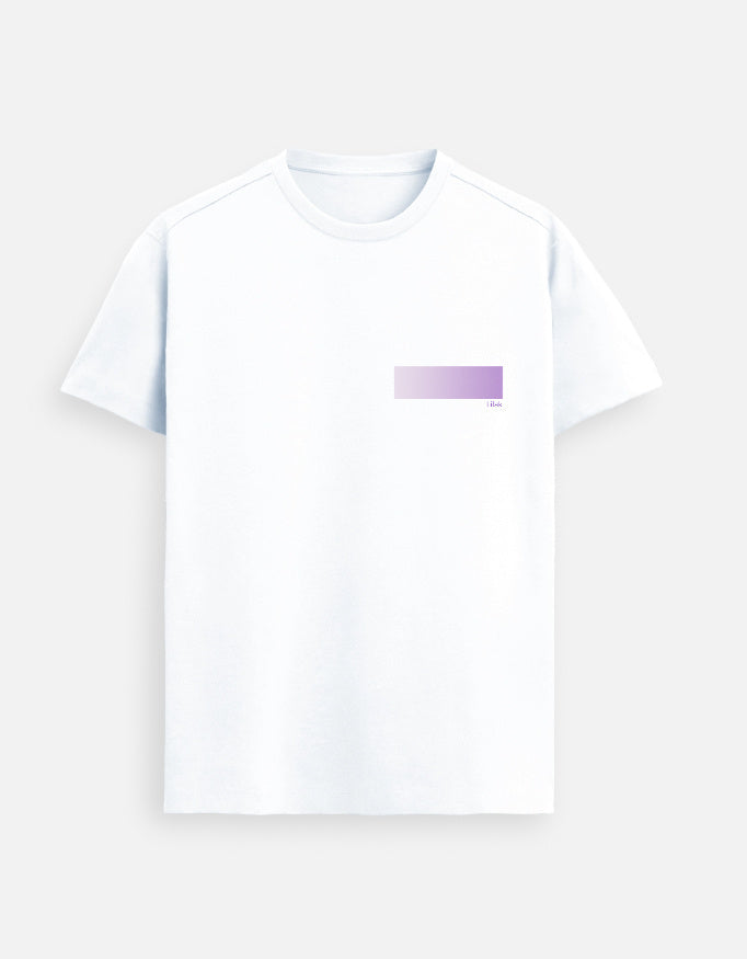 Woman wearing a premium supima cotton white t-shirt with a colorful square design on a city street.