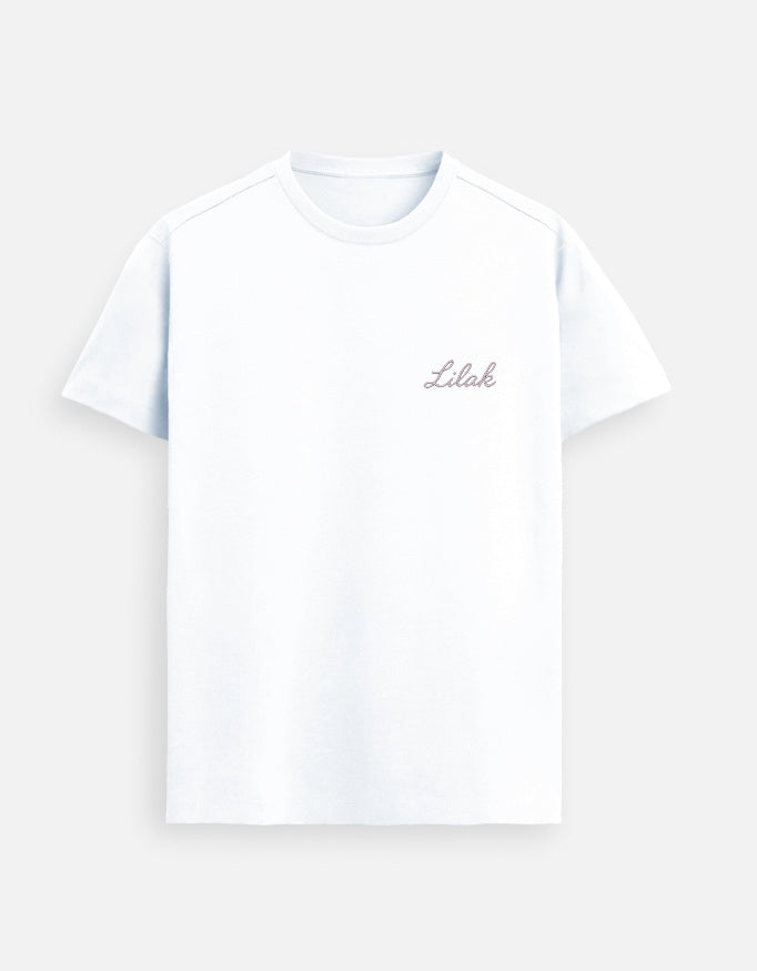White women’s premium Supima cotton t-shirt with minimalist “Lilak” logo, ultra-soft luxury casual wear in outdoor light