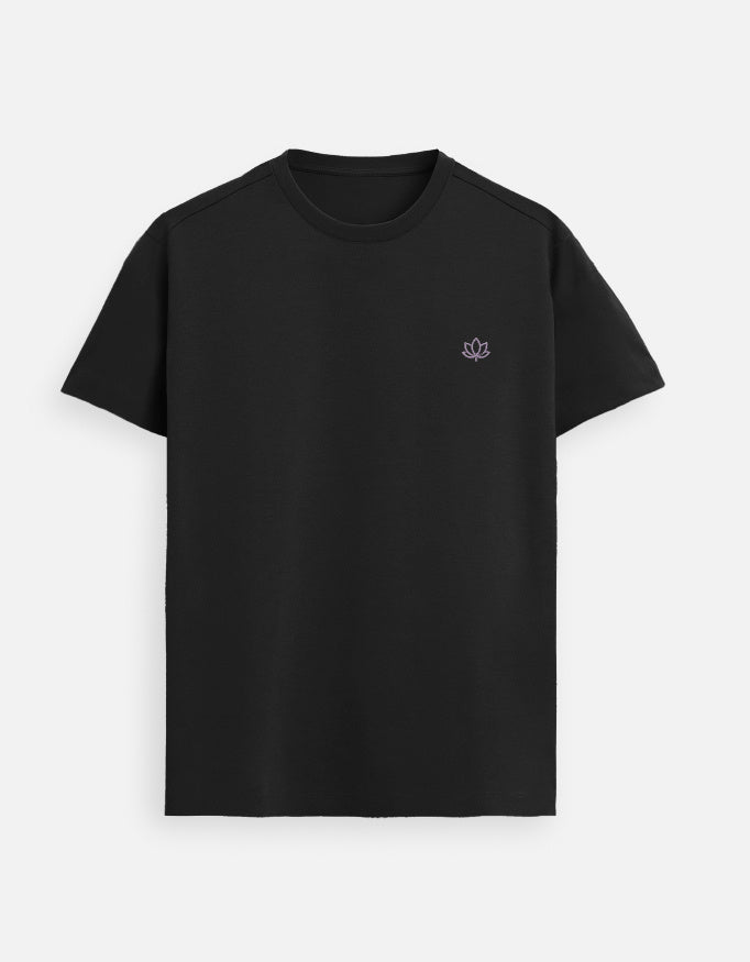 Black women’s luxury Supima cotton t-shirt featuring subtle lotus logo, modern minimalist streetwear fashion