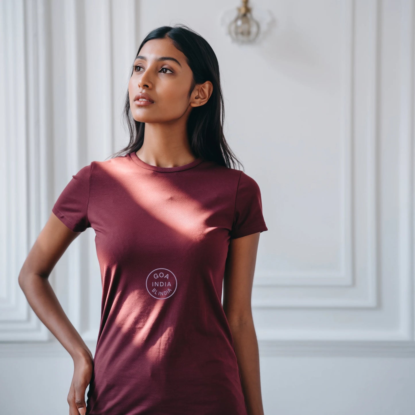Maroon women’s premium Supima cotton t-shirt with elegant circular graphic, rich color casual luxury wear