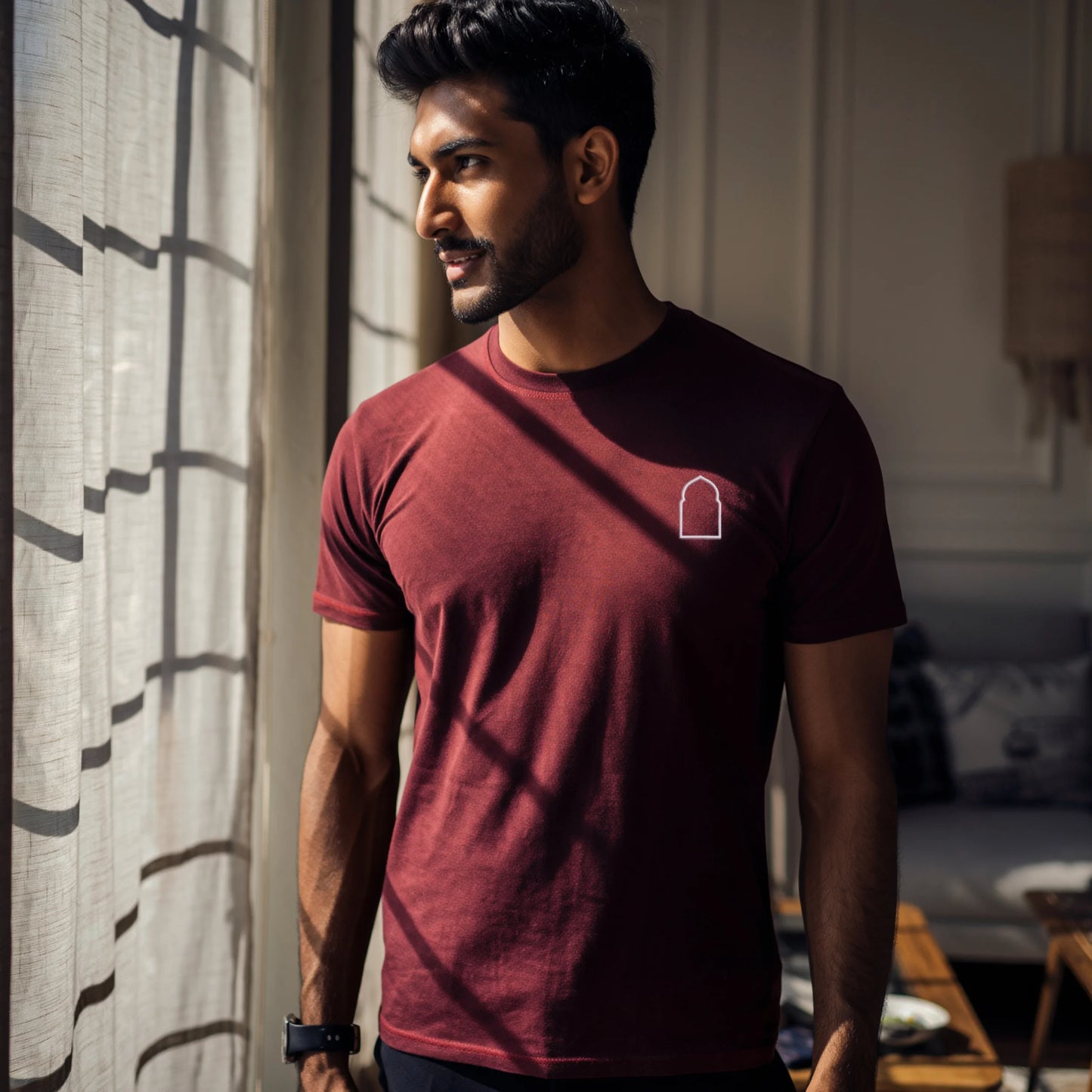 Maroon men’s premium Supima cotton t-shirt with understated embroidered emblem, rich-tone luxury casual fashion