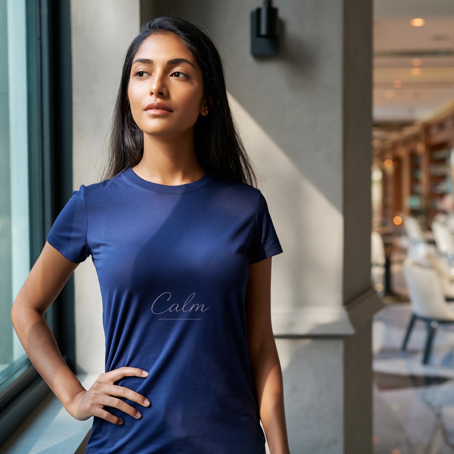 Navy blue women’s premium Supima cotton t-shirt featuring subtle “Calm” lettering, refined everyday luxury wear