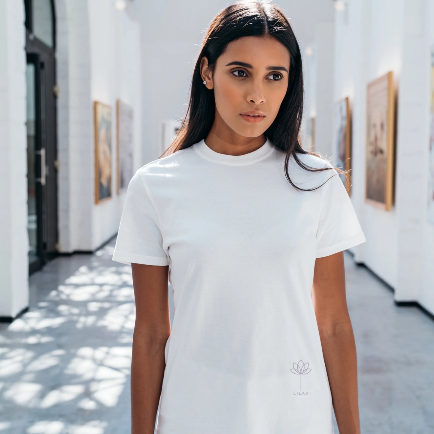 White women’s premium Supima cotton t-shirt, ultra-soft breathable fabric styled in elegant natural light lifestyle setting